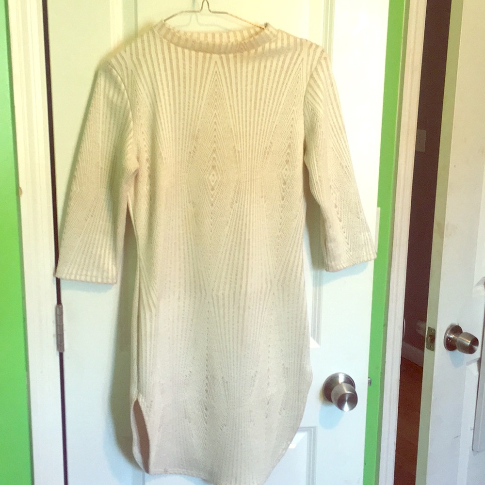 A knit turtleneck dress with high slits